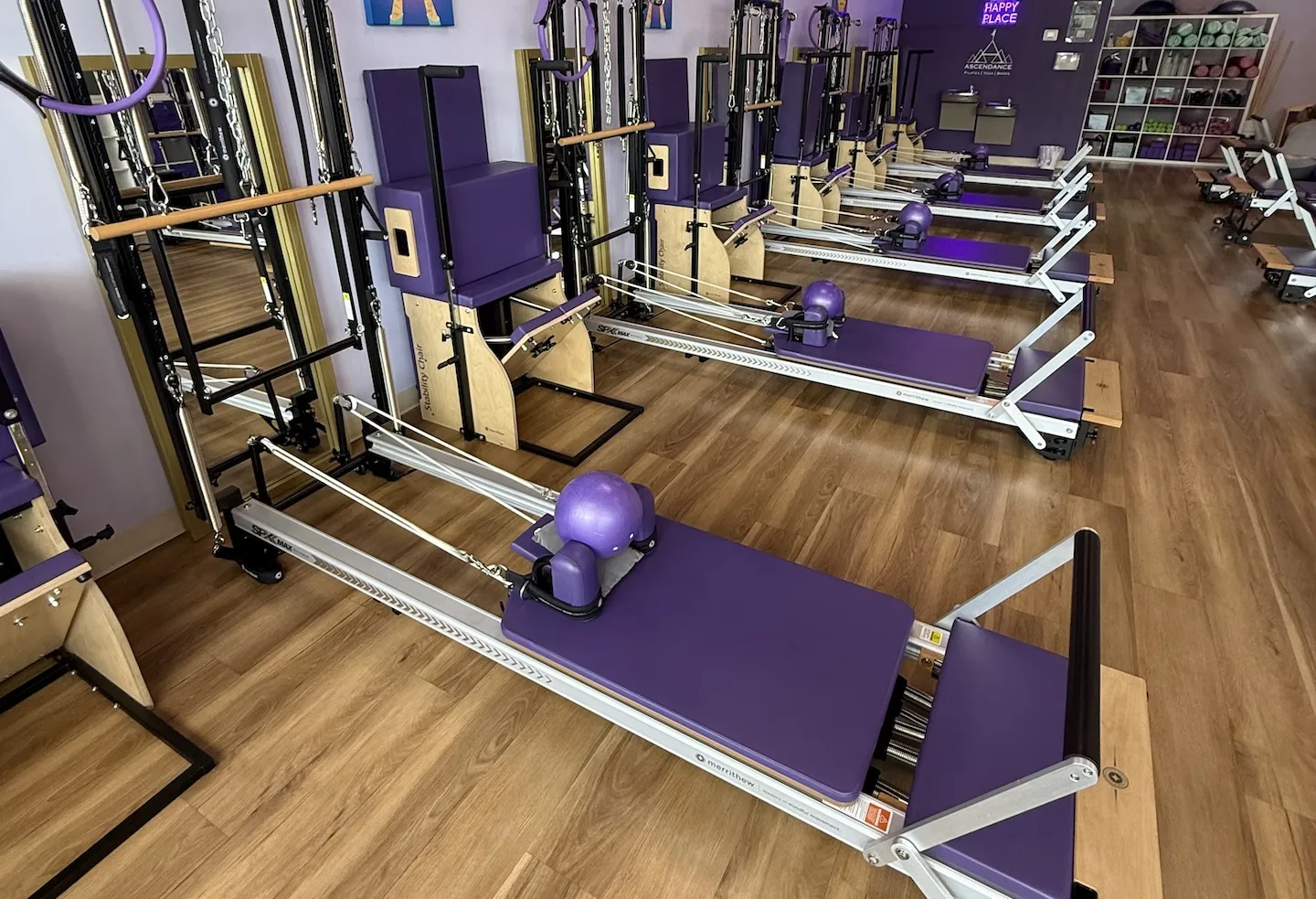 Row of reformer machines in Studio A at Ascendance